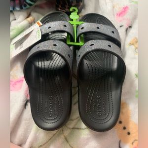 Women’s size 11 Crocs black and glitter sandals